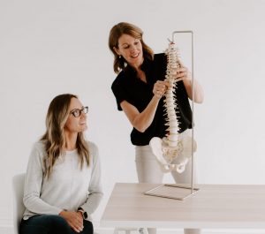 Chiropractor Dr. Laina Shulman showing the spine