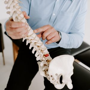 chiropractor pointing at spine
