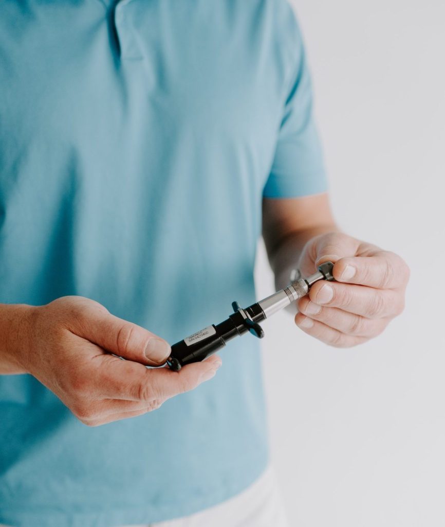 man in blue shirt holding activator