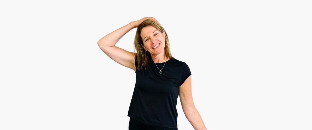 Woman performing gentle neck stretch to relieve tension — chiropractic exercise demonstration
